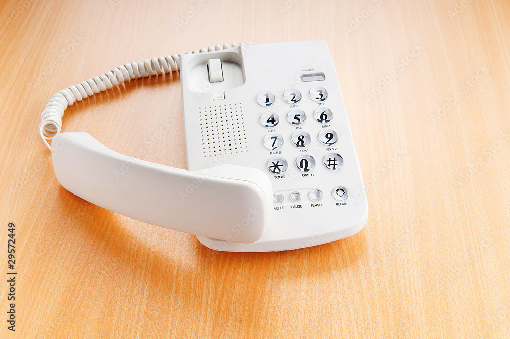 White office phone on the flat surface White office phone on the flat surface