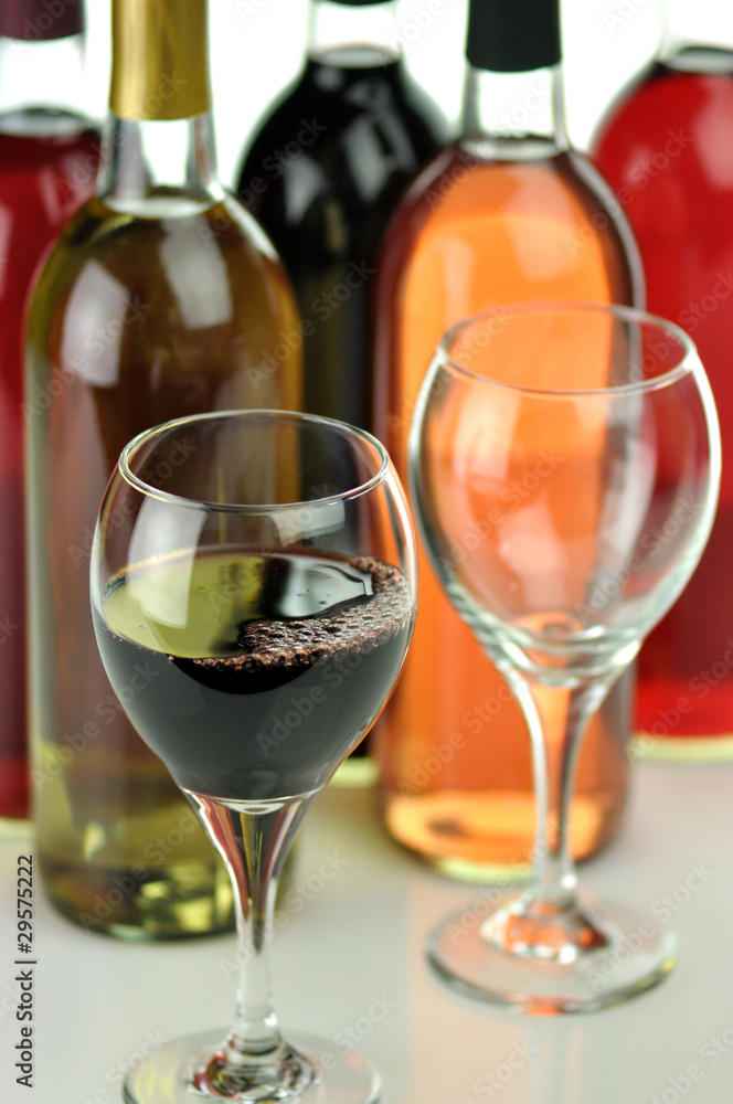 assortment of wine bottles and glasses assortment of wine bottles and glasses