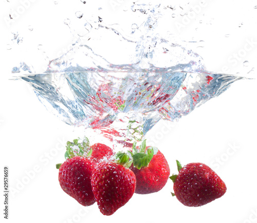 Strawberries Dropping Into Water