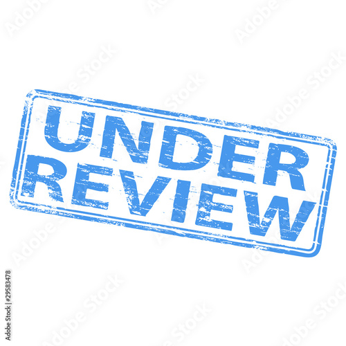 Rubber stamp illustration showing "UNDER REVIEW" text