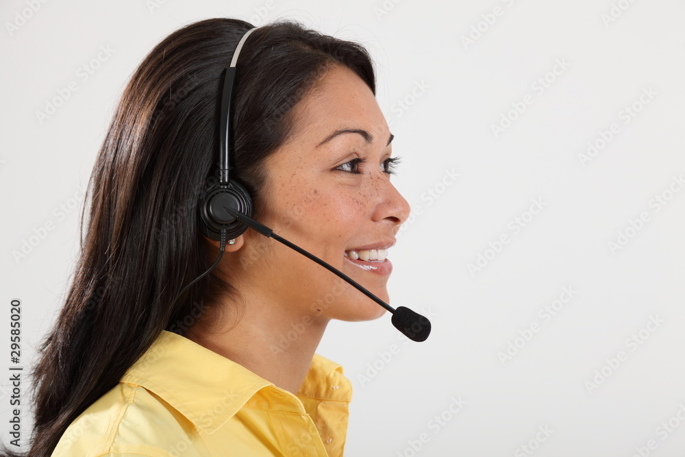 Headshot happy receptionist speaking on telephone Headshot happy receptionist speaking on telephone