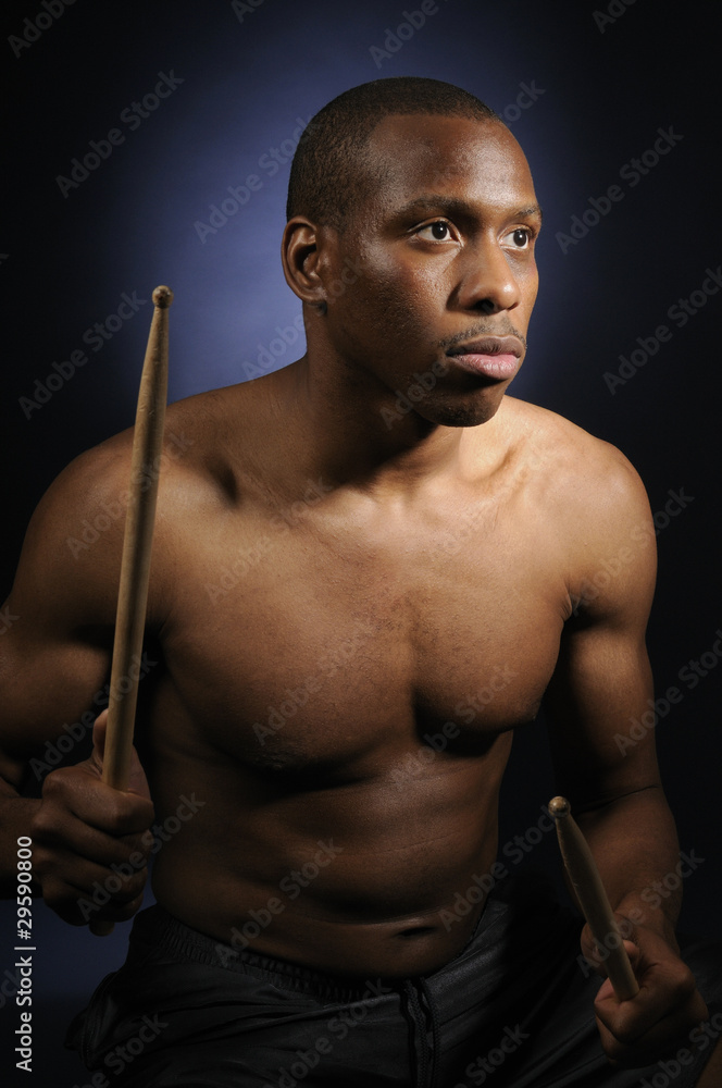 Close up of drummer with dramatic lighting Close up of drummer with dramatic lighting