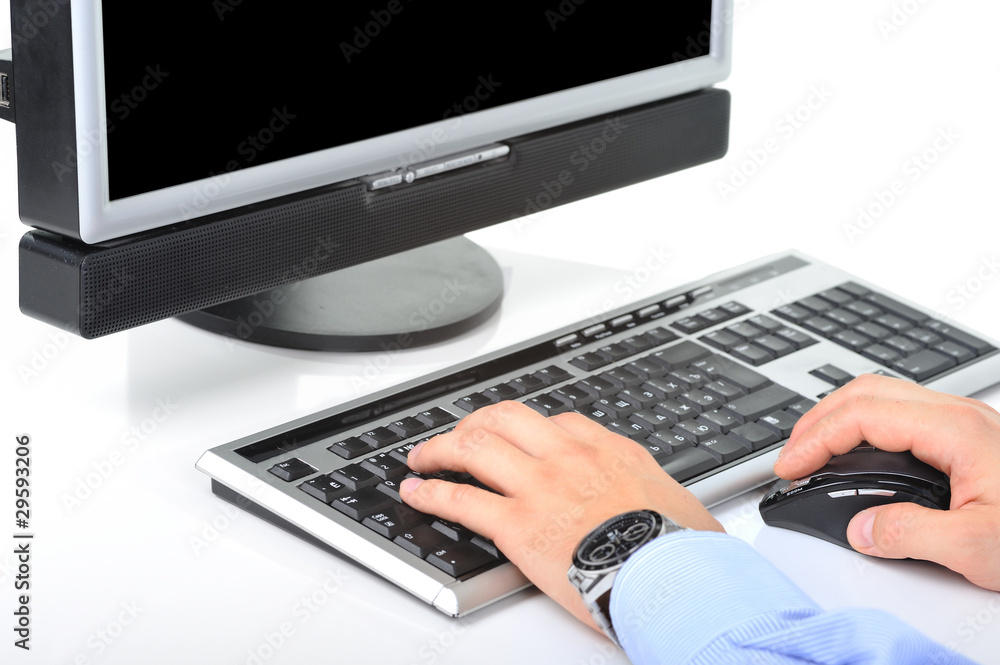 Office worker is typing a document on the desktop Office worker is typing a document on the desktop