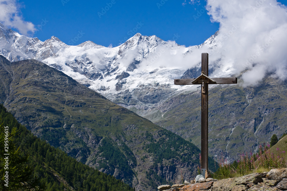 Religious cross in the swiss alps Religious cross in the swiss alps
