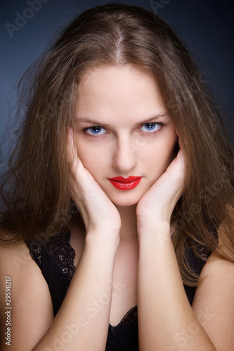 Portrait of beautiful young woman with big eyes