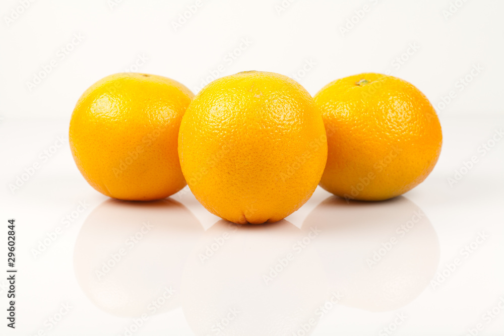 Three navel oranges on a white background Three navel oranges on a white background