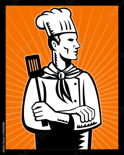 chef cook holding spatula looking up