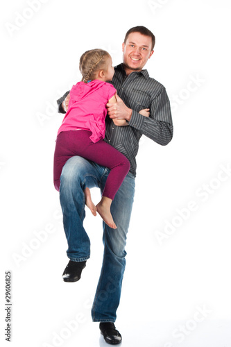 A young father and daughter playing