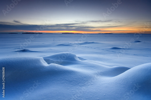 Snowy seascape in morning dawn