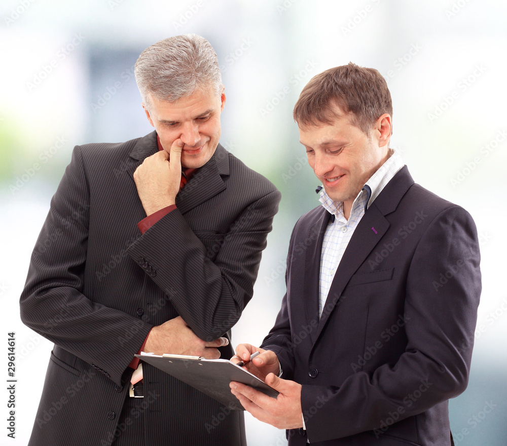 Fototapeta premium Two businessmen discussing - Isolated studio picture in