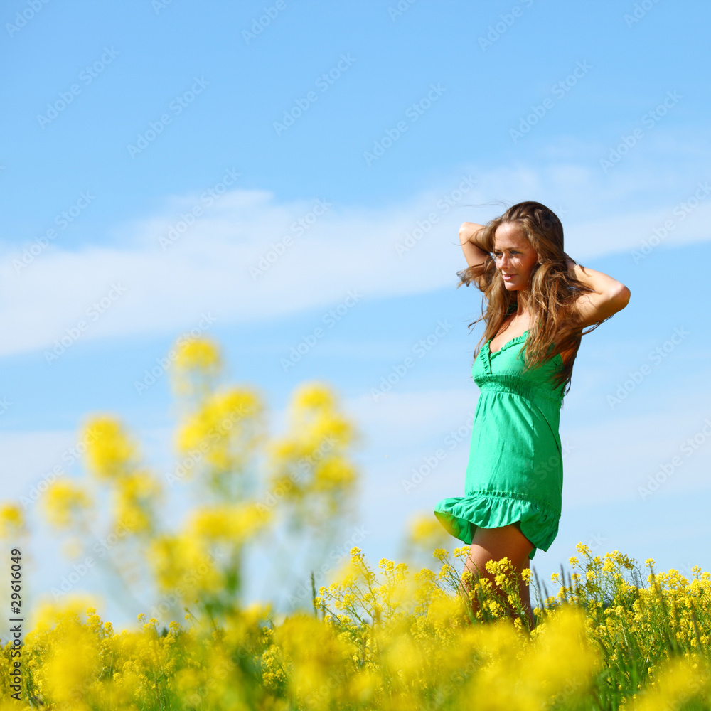 woman on oilseed field woman on oilseed field