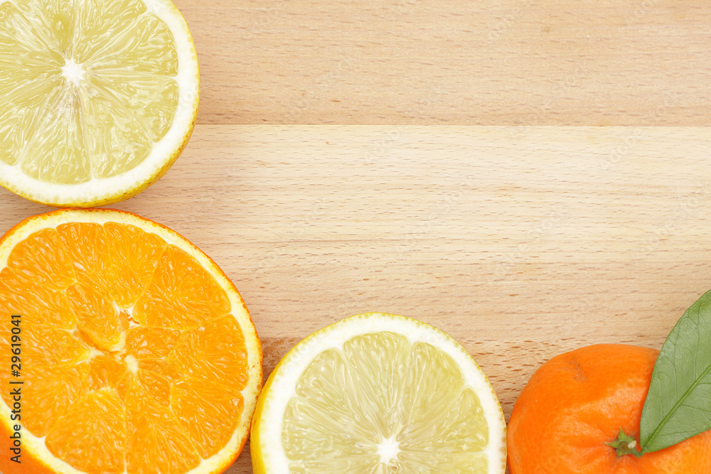 Citrus border on wooden table Citrus border on wooden table