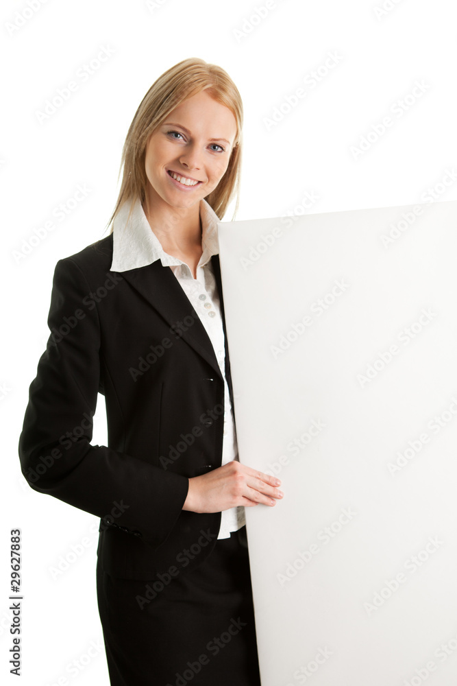 Cheerful businesswomen presenting empty board Cheerful businesswomen presenting empty board