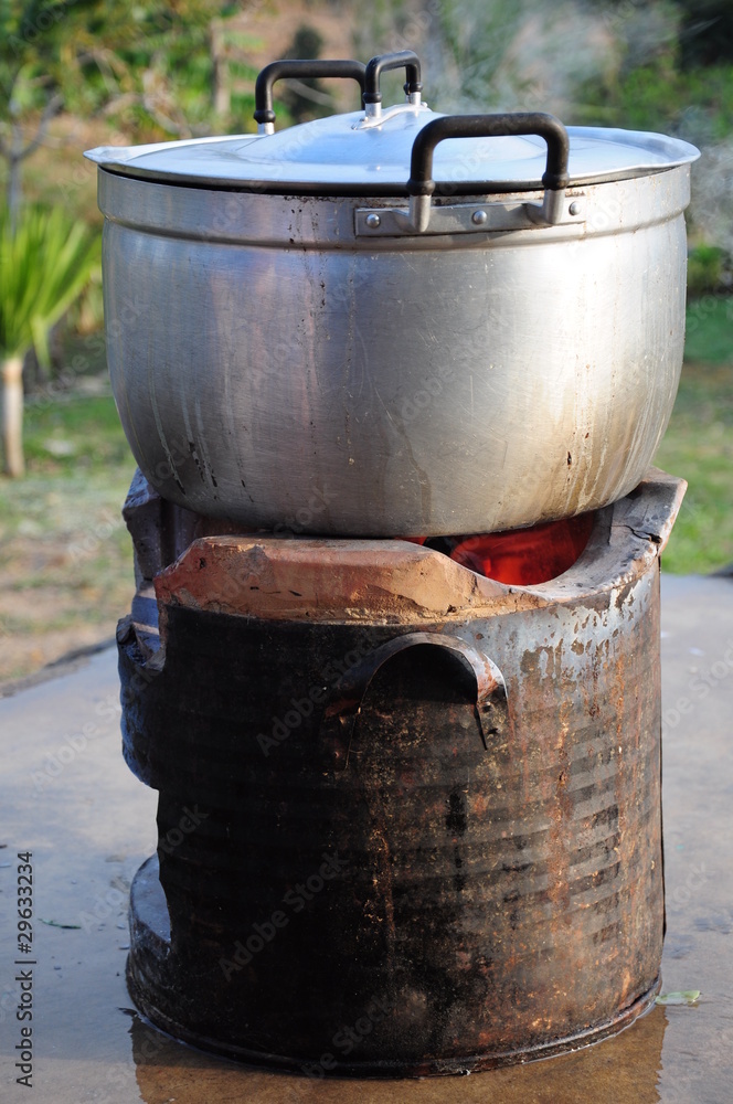 Rice Cooking on charcoal brazier Rice Cooking on charcoal brazier