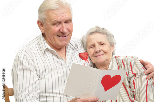 happy old couple with post-card