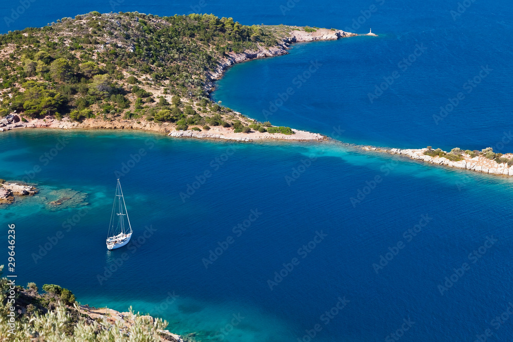Yacht in small quiet bay, Greece