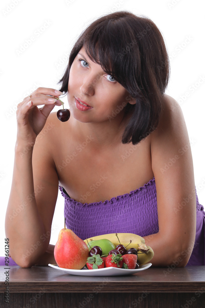 cheerful woman eating fruit and berrie cheerful woman eating fruit and berrie