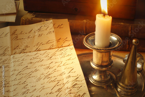 Old letter read by candle light from 1800's