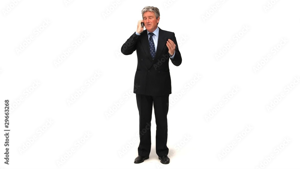 Elderly businessman making a phone call Elderly businessman making a phone call