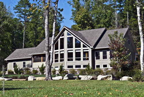 Large House with Windows and Rocks in the Landscape