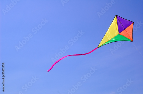 Kite against blue sky
