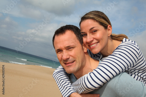 Happy couple at the beach © goodluz