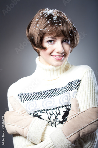 young beautiful girl rejoices to snow