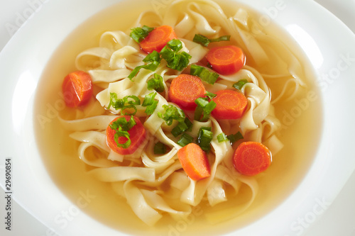 Chicken soup with macaroni and carrots , zupa