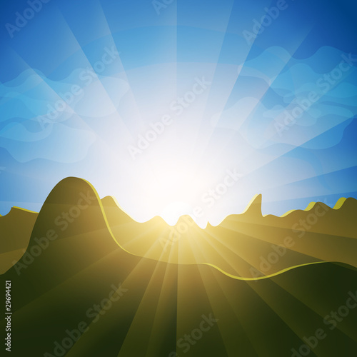 Sunburst rays over mountain tops