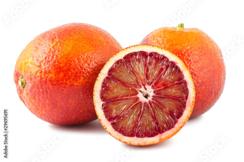 Full and two half of blood red oranges