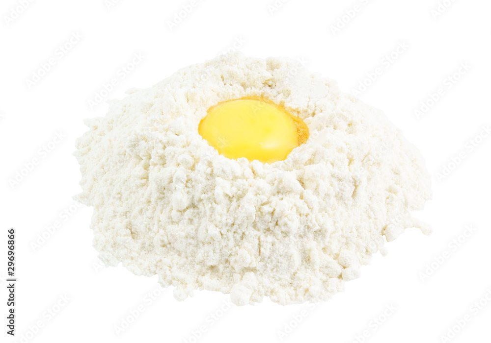 Yellow egg yolk in the flour isolated on white background Yellow egg yolk in the flour isolated on white background