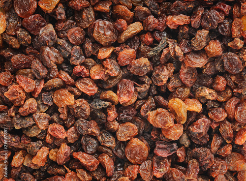 Dried red raisins, natural horizontal background