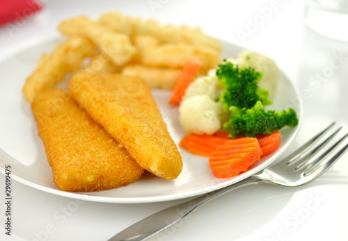 fish fillets with fried potato and vegetables,
