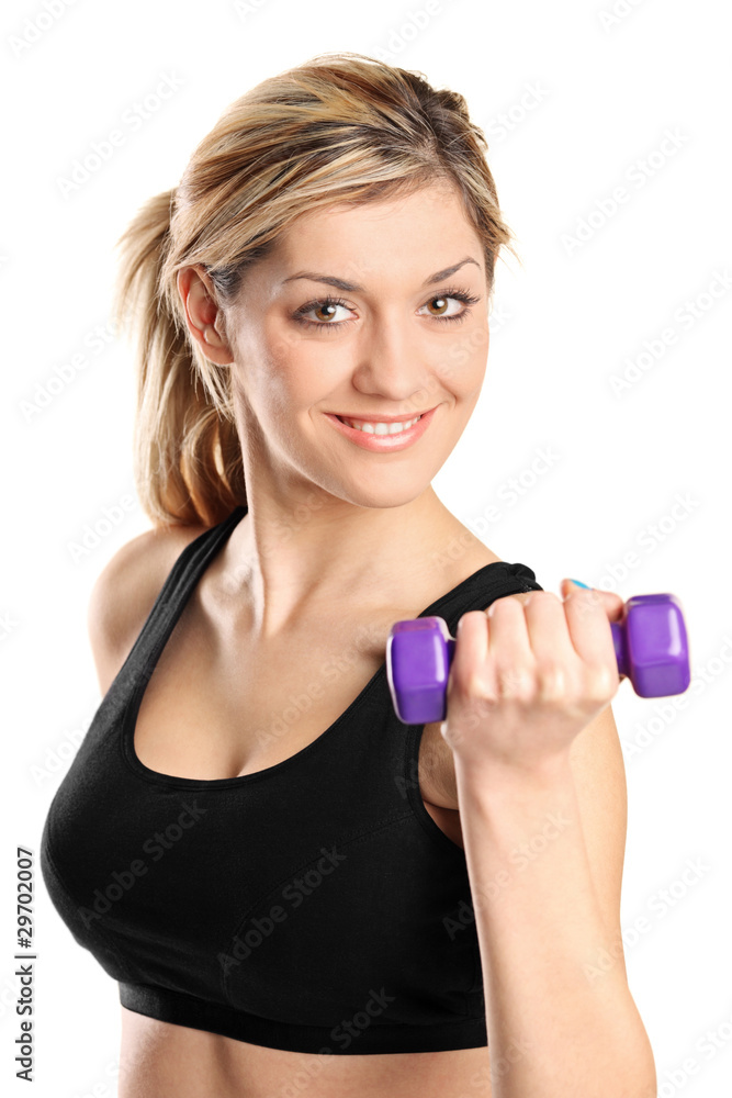 A young attractive woman exercising with weights A young attractive woman exercising with weights