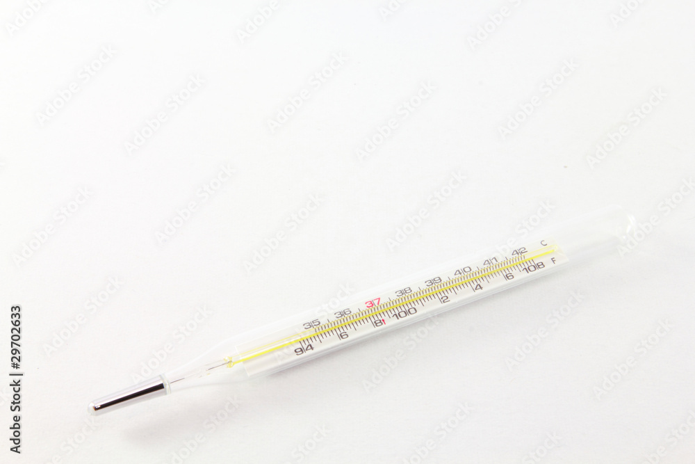 clinical thermometer with shallow depth of field on white clinical thermometer with shallow depth of field on white