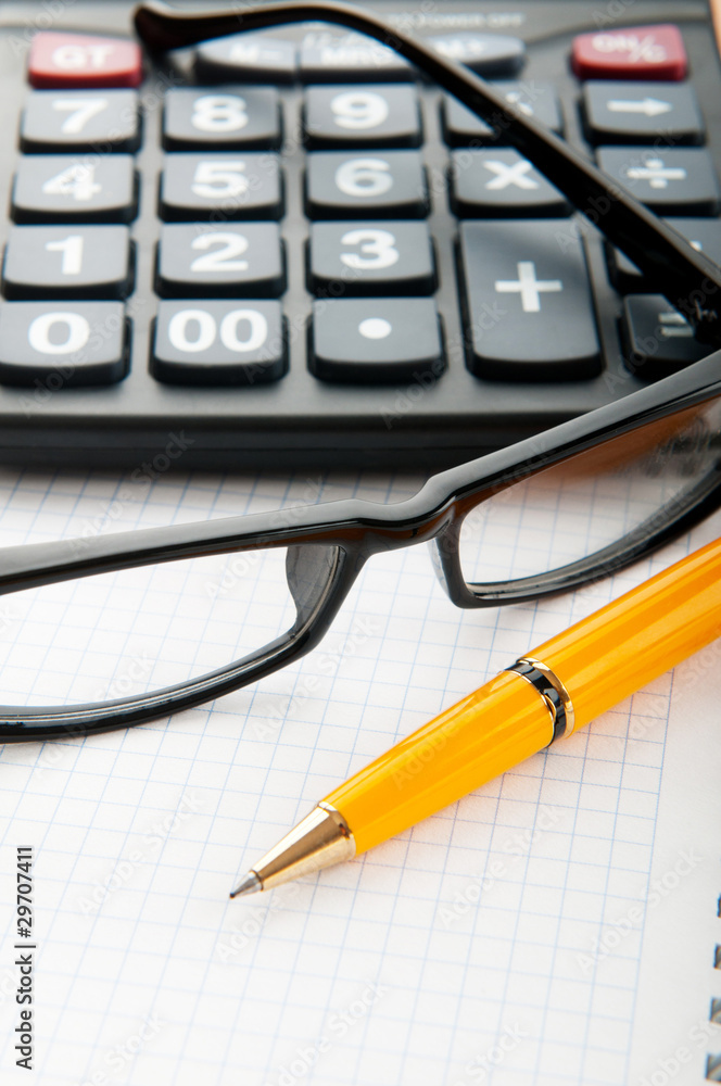 Business concept with notepad and calculator Business concept with notepad and calculator
