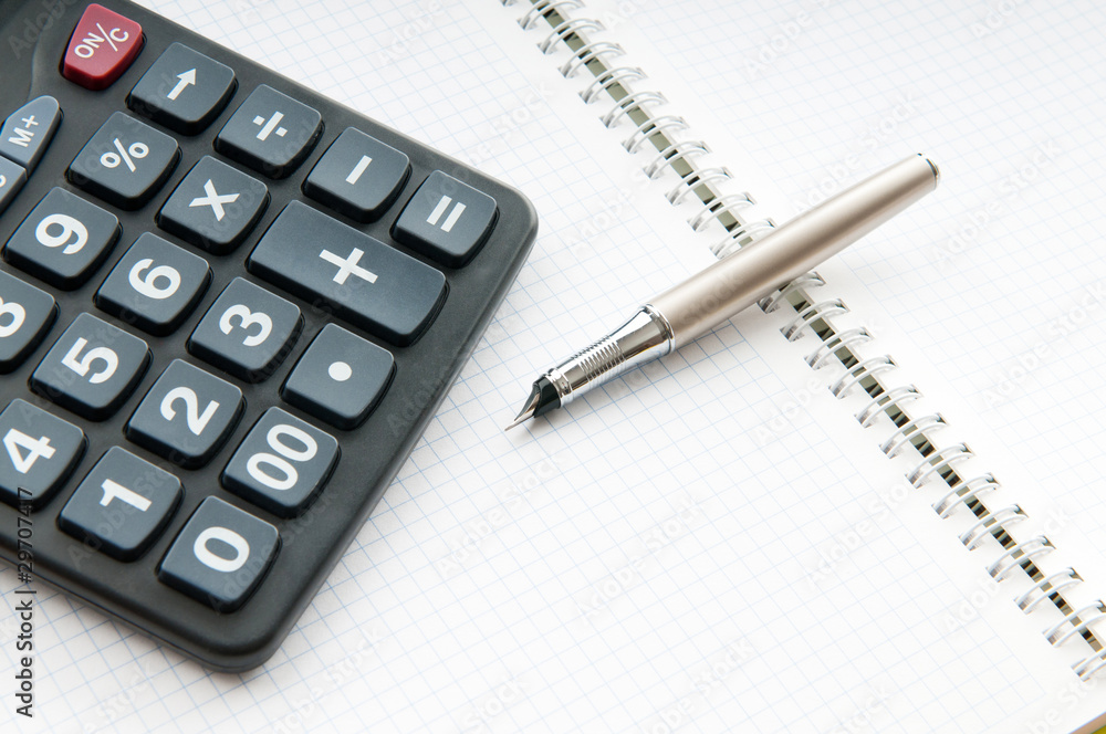 Business concept with notepad and calculator Business concept with notepad and calculator