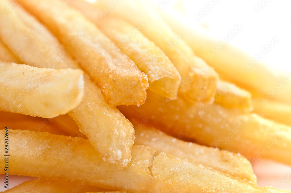 Fries french potatoes closeup isolated on white Fries french potatoes closeup isolated on white