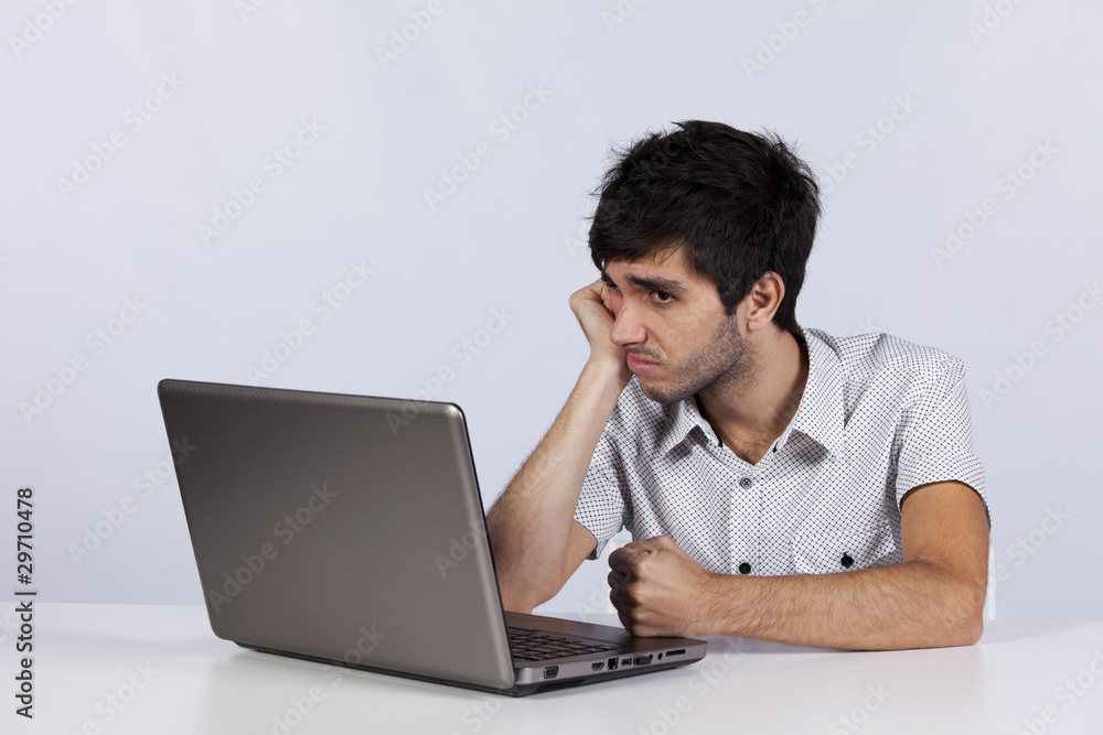 Young working with his laptop