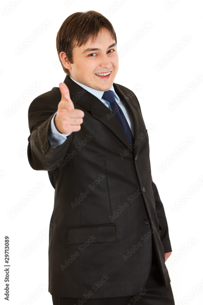 Smiling elegant businessman pointing finger at you
