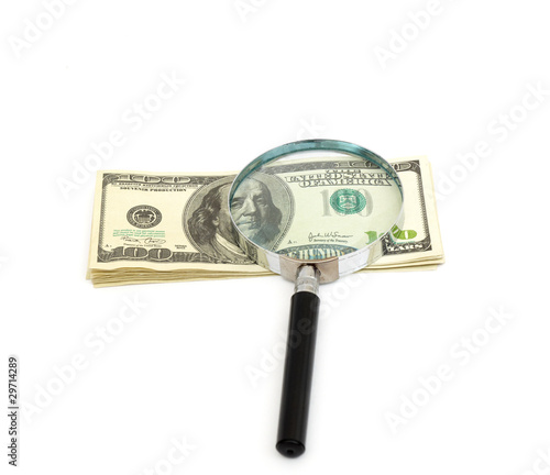 Magnifying glass on money