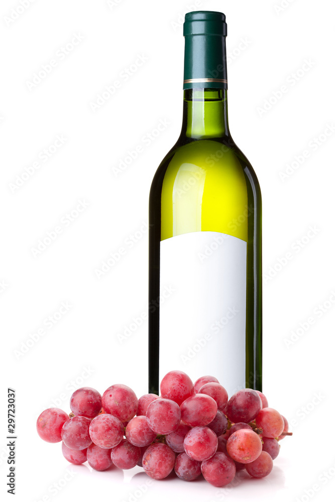 White wine in green bottle and grapes branch
