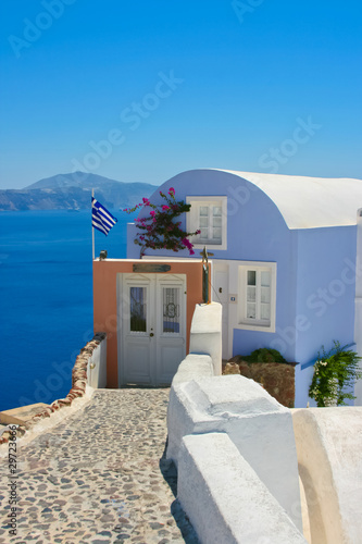 Beautiful blue house with white windows on Santorini