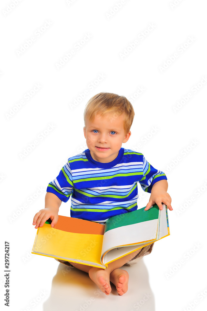 Cute little boy is reading a book Cute little boy is reading a book