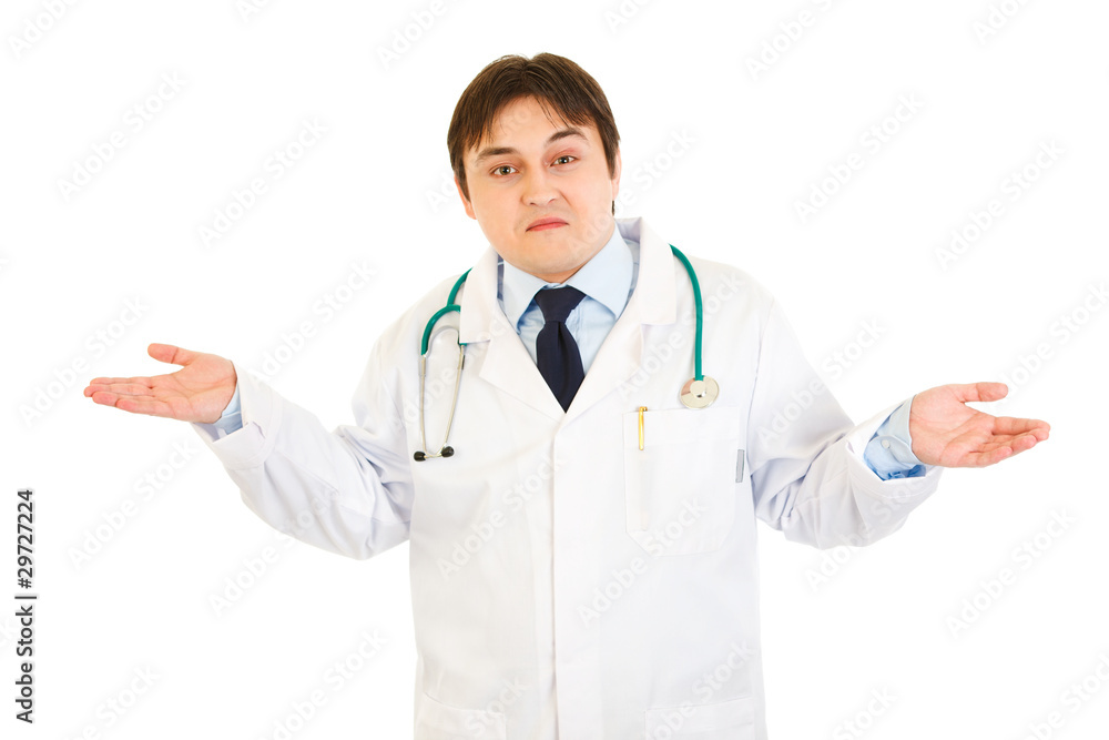 Young medical doctor with confusion expression on his face Young medical doctor with confusion expression on his face