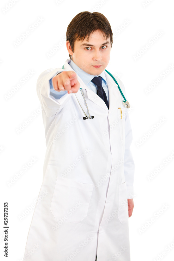 Confident young medical doctor pointing finger at you Confident young medical doctor pointing finger at you