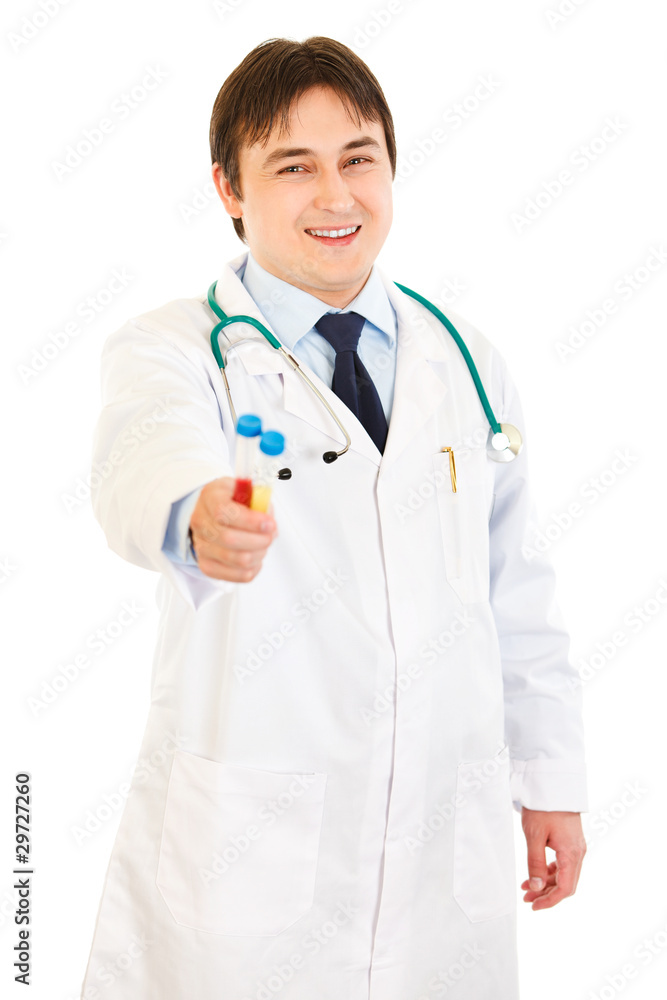 Smiling medical doctor holding test tubes in hand isolated Smiling medical doctor holding test tubes in hand isolated