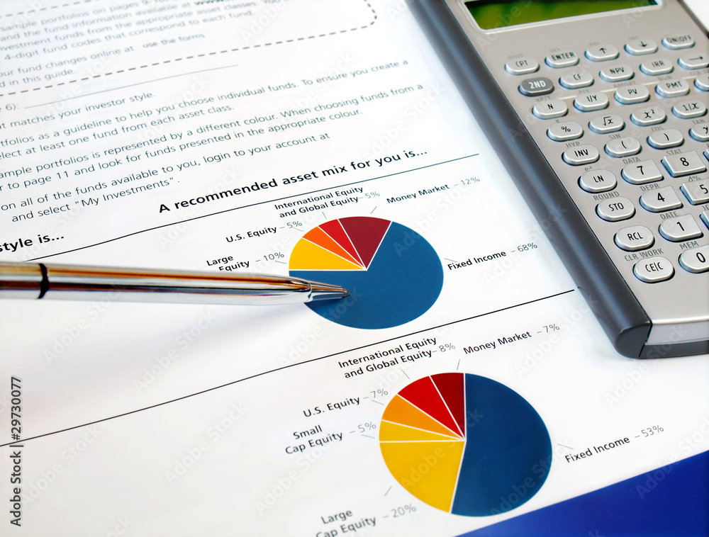 Pen on the investment chart with calculator Pen on the investment chart with calculator