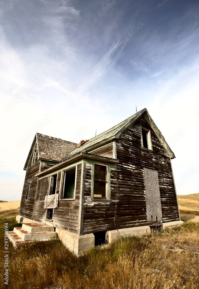 Abandoned old farm house in the Dirt Hills of Saskatchewan Abandoned old farm house in the Dirt Hills of Saskatchewan