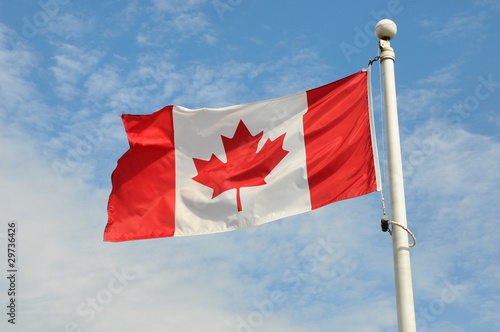 Canadian flag flying in the wind